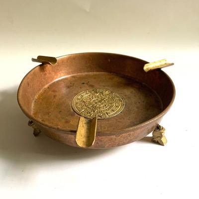 Sale Photo Thumbnail #107: Vtg. copper and brass ashtray w/ Mayan Sun calendar medallion