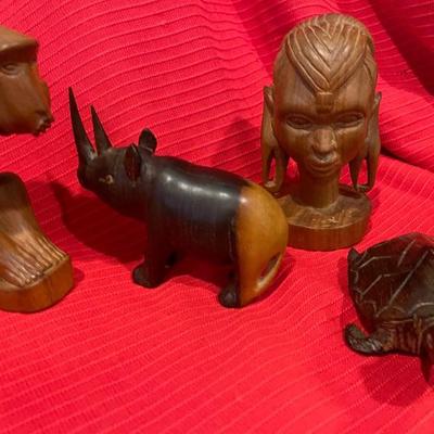 Collection of hand carved wooden figurines some from kenya