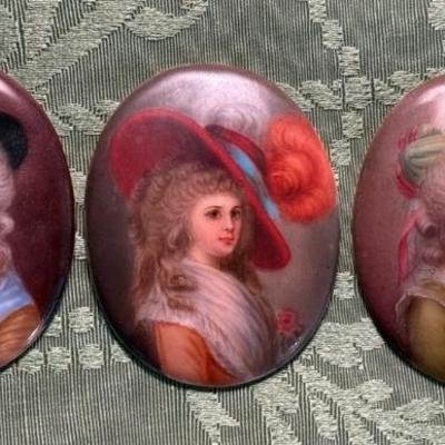 A trio of miniature portraits on porcelain