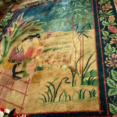 Large Chinese art deco carpet, distressed condition. Blue floral trim center to lady’s in a garden