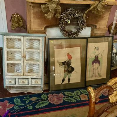 Wall cabinet, framed portraits