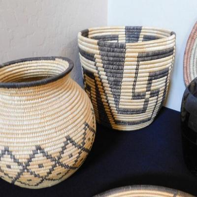 Basket on the left is Pima, fine coil weave of willow and devils claw over cattail reed. Basket on the right is Papago, Large fine coil...