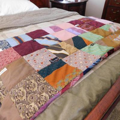 This quilt still has all the original apparel labels from the clothing used in its creation. Johnny Carson, Yves Saint Laurent, Gucci,...