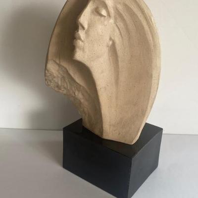 This Sculpture Depicts A Stylized Female Bust In A Contemplative Or Dream-like Pose. 