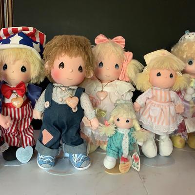 Variety Of Precious Moments Dolls On Metal Stands