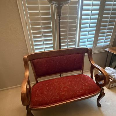 Old Sette With Claw Feet And An Old Floor Lamp