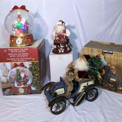 Huge Light-Up Musical Holiday Globe with Decorative Santas