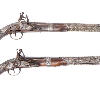 Sale Photo Thumbnail #76: Lot 76 pair of lavishly silver mounted flintlock pistols 18th 19th c.
