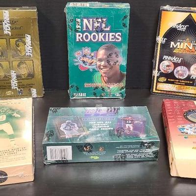 Pinnacle & Classic Football Card Collection – Sealed 1990s Boxes Featuring NFL Rookies & Inserts
