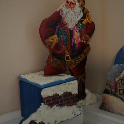 The hand painted folk-art style Santas, Wood and Scandinavian
style to them 