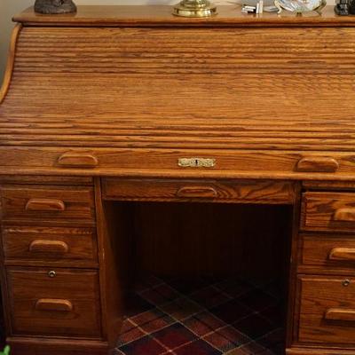 reproduction roll top desk. very nice with an easy roll top and good drawers for the office supplies. A good size and easy to find a...