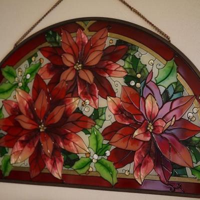 Stain glass arch of poinsettias. 