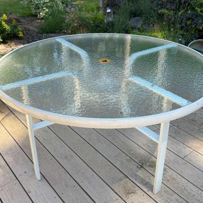 Round glass topped patio table