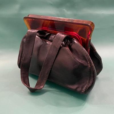 Black leather purse with amber colored clasp