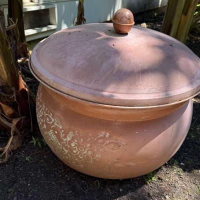 Pot to cover garden hose