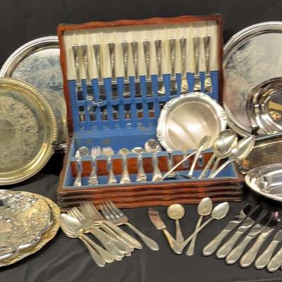 Large Collection Of Stainless And Silver-Plated Flatware And Serving Platters