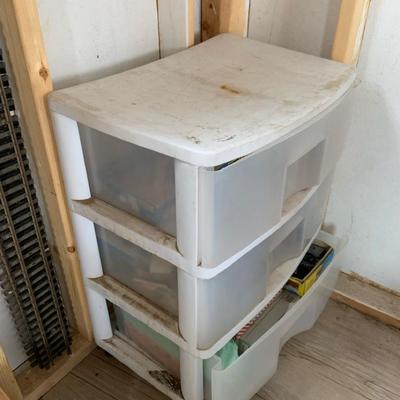 Storage Shelf With Scale Model And Train Accessories