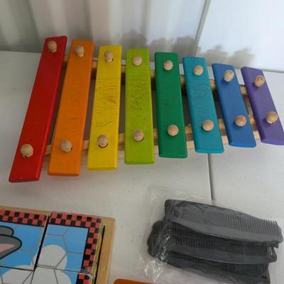 A vibrant wooden xylophone, perfect for introducing young children to music, rhythm, and color recognition. Promotes fine motor skills...