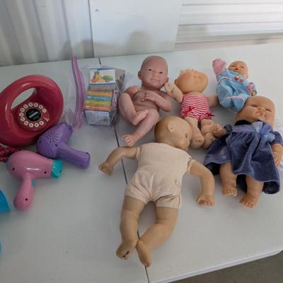 A collection of 5 assorted baby dolls, perfect for nurturing play, learning about caregiving, and encouraging social-emotional...