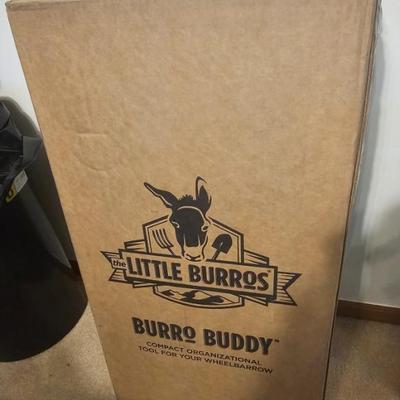 Burro Buddy a drink holder, long handle tool holders, short handle tool holders, and a water resistant compartment for your cell phone....