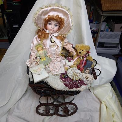 Porcelain doll in buggy