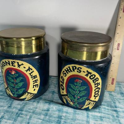 Two Painted Stoneware Pottery Containers With Brass Lids