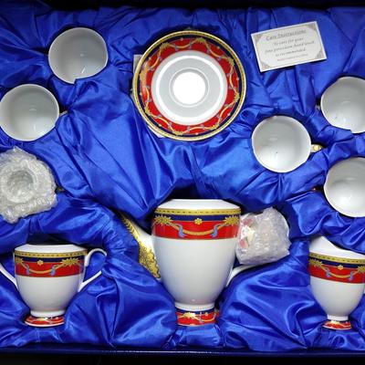 Box of Sorelle Fine China with red accents