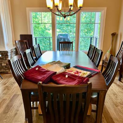 Beautiful Amish Solid Wood Dining table with two leaves and 10 chairs