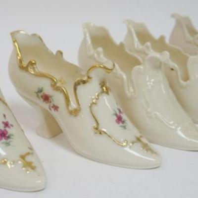 Sale Photo Thumbnail #84: 1084	LENOX CHINA GROUP OF 5 ASSORTED FIGURAL LADIES SHOE DISHES, 2 WITH GILT TRIM AND FLOWERS, GOLD LEAF MARK, APPROXIMATELY 6 IN X 2 IN X 3 IN
