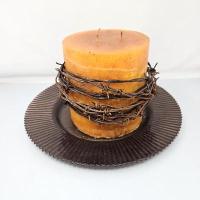 Rustic Orange Candle on Dark Glass Plate with Barbed Wire Wrap Candle is 6" x 7"