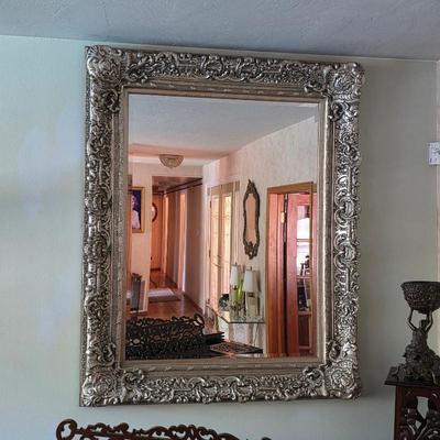 Ornate silver wall mirror