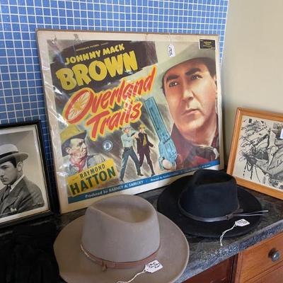 Cowboy poster and hats 