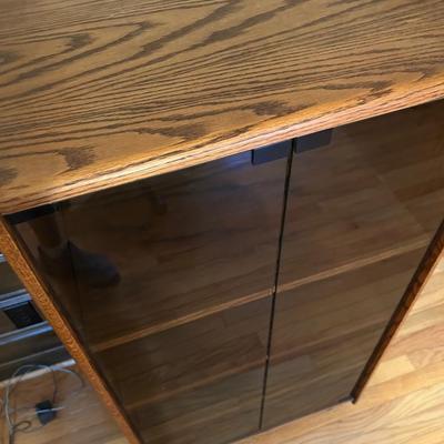 Stereo Electronics Cabinet With Adjustable Shelves, Tinted Glass Doors And Rollers