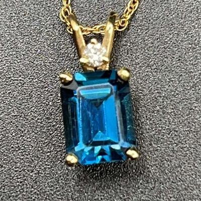 Bluish-Green Emerald-Cut Solitaire Stone & Smaller Round Stone Pendant On 14K Gold Chain