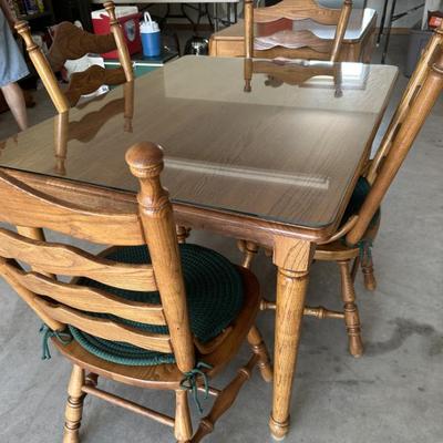 Sale Photo Thumbnail #200: Oak table with glass top and 4 chairs
