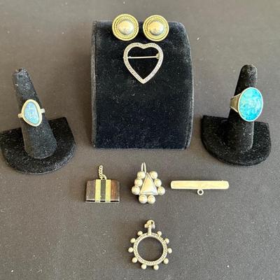 Sterling Silver Jewelry Lot: 56g- 2 rings, 1 set earrings, 5 pendants