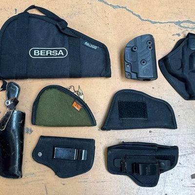 #738 • 2 Soft Pistol Cases and 6 Holsters
