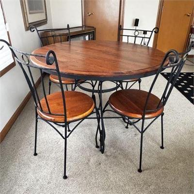 Lot 382   
Wrought Iron And Wood Round Table And Chairs