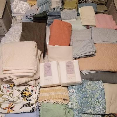 Large Assortment of Blankets, Quilts, Linens, Towels and More.