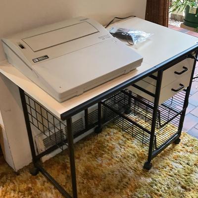 Vintage Typewriter With Toshiba Calculator On Top Of Vintage Work Desk With Outlets 