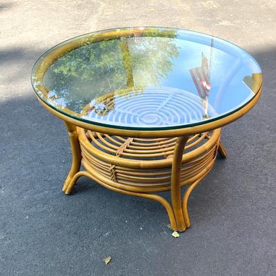 Vtg. rattan coffee table w/ glass top.