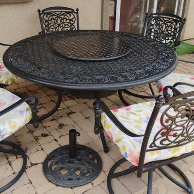 Large 60" Round Metal Patio Table And 6 Rocker Chairs
