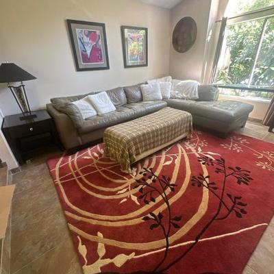 Sectional couch, ottoman, decorative rug, side table & lamp