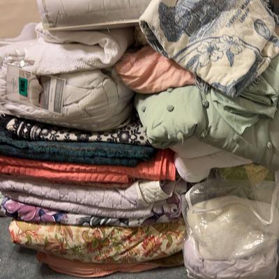 Bedding Collection Featuring Decorative Pillows, Quilts, and Comforters