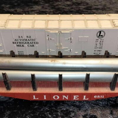 Lionel 3482 Automatic Refrigerated Milk Car & Lionel 6511 Red Pipe Car With 5 Pipes