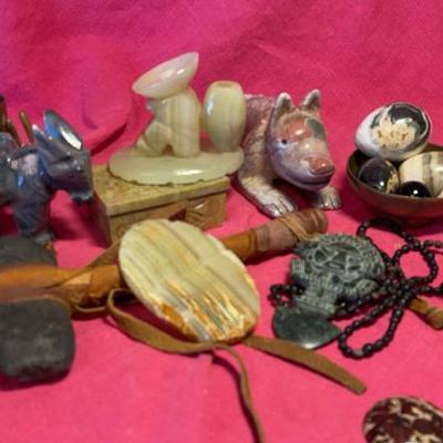 Mix of stone and brass trinkets
