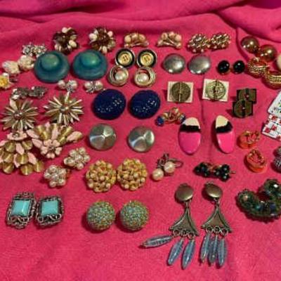 A giant collection of clip on earrings