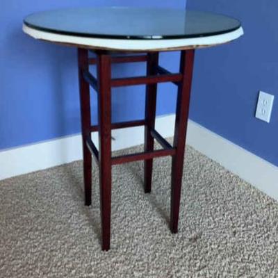 Glass top pedestal side table with tablecloths