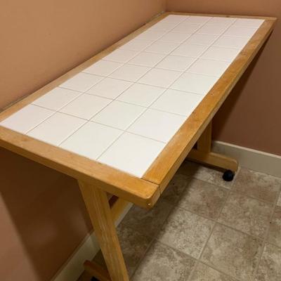 Tile top table on casters