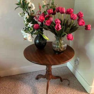 Round side table and two bouquets of silk flowers